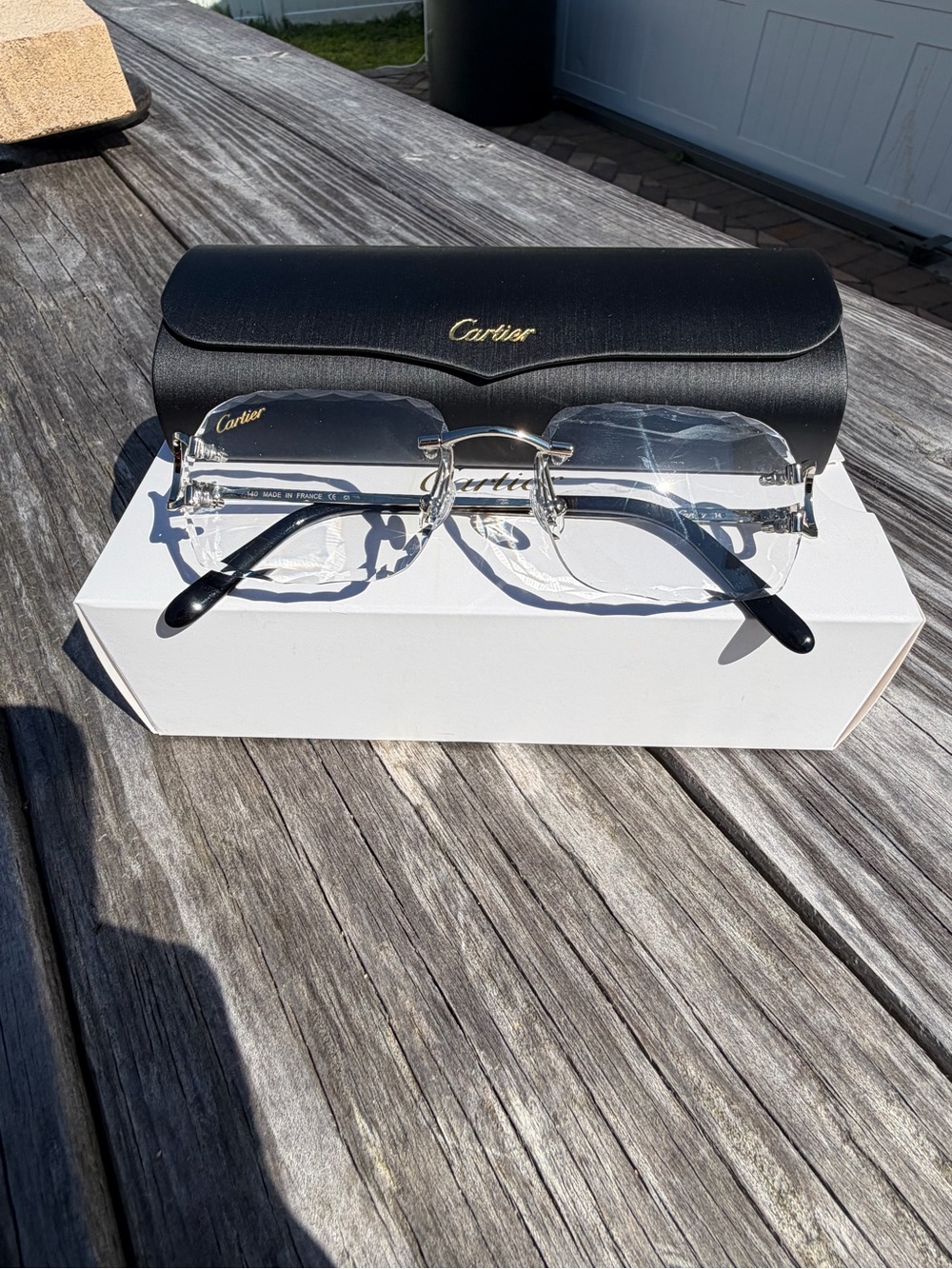 Cartier Rimless clear lens Glasses with Black Temples and Gold Accents